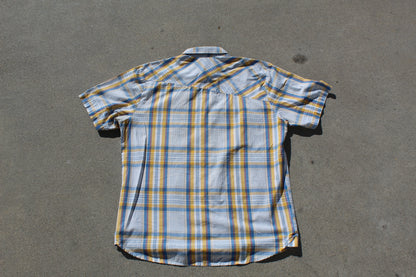 Plaid shirt on a gray surface

